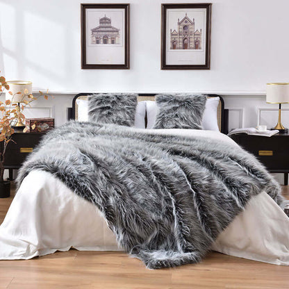 A grey faux fur throw blanket on the bed. Can also be used as faux fur duvet cover. Easy to clean and keep warm. Queen size and king size are available.